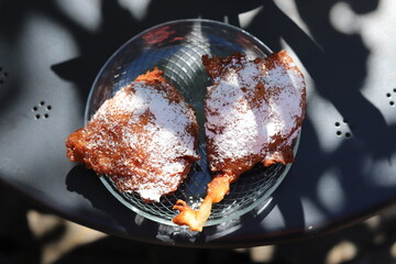 Ruchanki - traditional dessert baked from bread dough, hot fried on fat, topped with powdered sugar, Kashubia, Poland - obrazy, fototapety, plakaty
