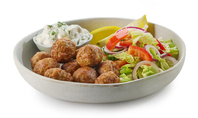 plate of meat balls and vegetable salad