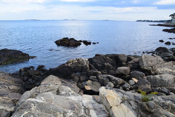 Fototapeta na wymiar Large Stones on the Bay in Massachusetts, Clear Water