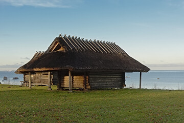 Old wooden fishermen`s hut along the baltic sea on a sunny day in the Estonian open air museum,...