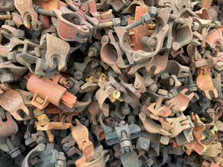 Industrial iron rusty metal clamps clamps hardware fasteners for chemical industry or construction. Background, texture