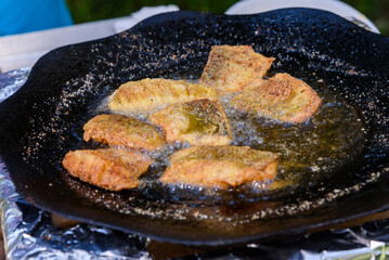 Frying fresh river fish in nature