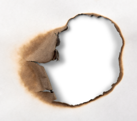 Close-Up View of a Burnt Hole in a Paper