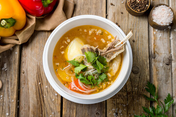 shurpa asian soup on old wooden table top view