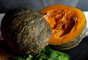 a cut pumpkin with lettuce.