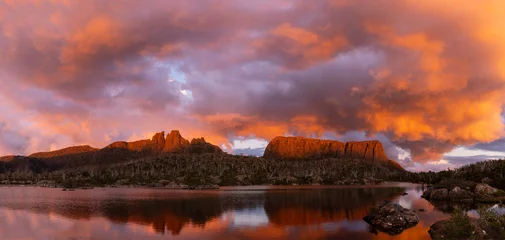Wall murals Cradle Mountain panorama of mt geryon and lake elysia during a brilliant red sunset at the labyrinth in cradle mountain-lake st clair national park