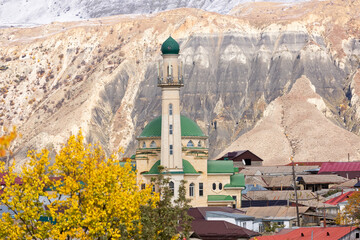 Panoramic view of Salta village, Dagestan, Russia. Mosque and houses in a small mountain village. Minaret on the background of mountains.