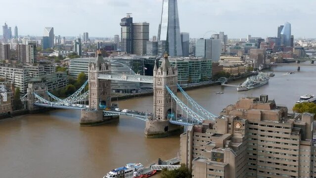 Iconic Tower Bridge connecting London with Southwark on the Thames River. Aerial view of London city center and the Tower bridge the symbol of London. 