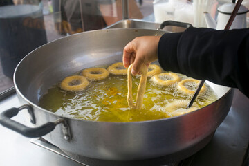 Picarones are ring-shaped fried sweets made with wheat flour dough mixed with pumpkin, and sometimes sweet potato, bathed in flavored chancaca honey. It is a traditional dish of the Peruvian and Chile