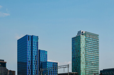 Fototapeta na wymiar Exterior of beautiful modern skyscrapers against blue sky