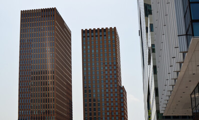 Exterior of beautiful modern skyscrapers against blue sky