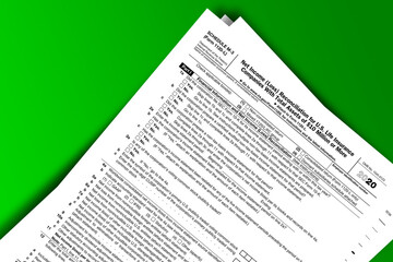 Naklejka premium Form 1120-L (Schedule M-3) documentation published IRS USA 12.22.2020. American tax document on colored