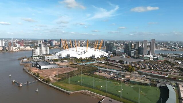 Aerial bird's eye view of iconic concert Hall of O2 Arena in North Greenwich Peninsula in London. Beautiful city of London from above.