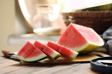 Sliced fresh juicy watermelon on wooden table, closeup