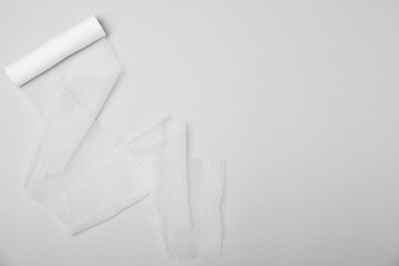 Medical bandage on white background, top view. Space for text