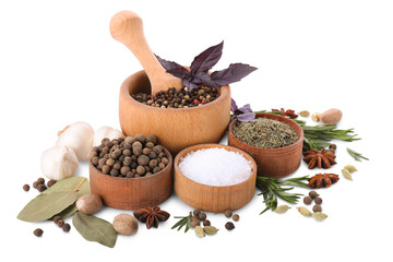 Mortar with pestle and different spices on white background