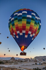 Flight of hot air balloons  over Goreme national Park. The sunrise in Cappadocia (Turkey).