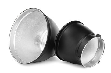 Studio flash lights reflectors on white background. Professional photographer's equipment