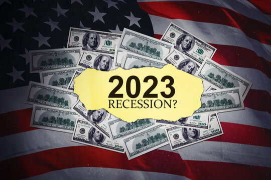 2023 recession text with American flag background - Powered by Adobe