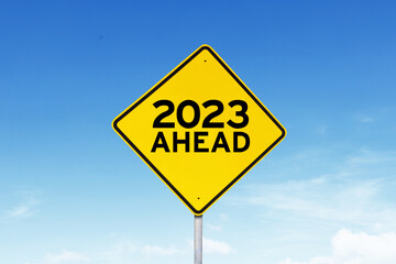 Yellow signpost with text of 2023 ahead