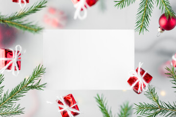 New Year's background. gifts in red wrapping paper and Christmas tree branches in a multi-layered design, on a white background.