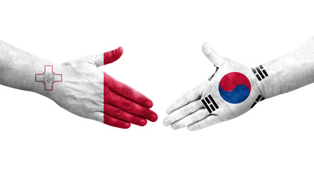 Handshake between Malta and South Korea flags painted on hands, isolated transparent image.