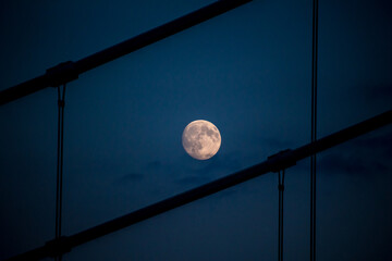 moon in the sky over the bridge