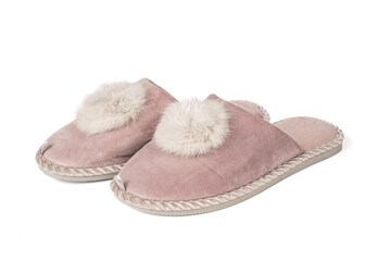 Beige slippers with fur trim isolated on a white background.