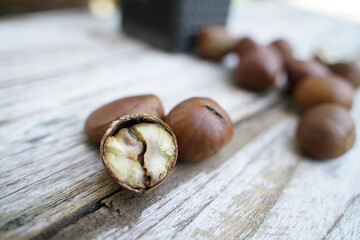 Fresh chestnuts isolated on a wooden floor, chestnuts have an oily sweet taste.