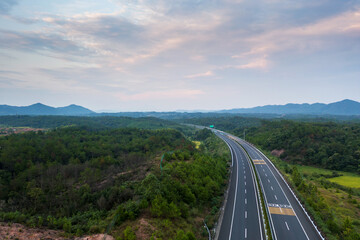 country road and green mountains in summer