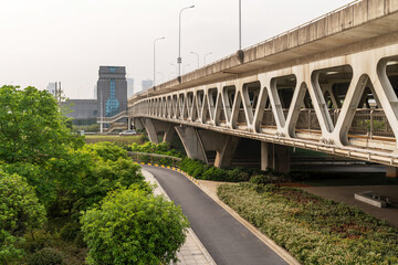 Pedestrian bridge against blue sky