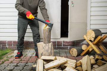 Man cutting firewood for the winter.