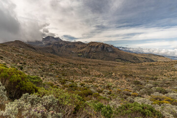 Fototapeta na wymiar The majestic black lagoon in the snowy park where the Nevado del Ruiz, Nevado del Tolima and the Nevado Santa Isabel are located