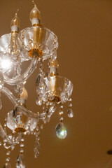 Luxury ceiling crystal chandelier in hotel bright reflections