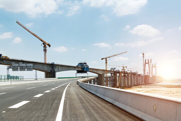 Construction of bridge under blue sky - Powered by Adobe