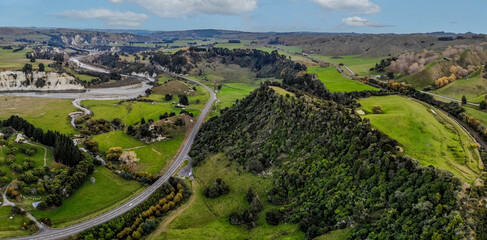 An aerial drone image of the main New Zealand State highway running through the valley of...