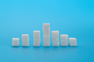 Sugar cubes chart on blue background