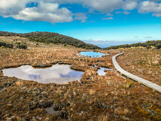 Fototapeta na wymiar An aerial image of two small lakes on an Alpine tarn on the slopes of an active volcano Mount Ruapehu in the Tongariro National Park in New Zealand