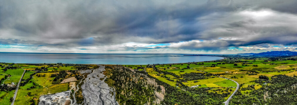 A Panoramic Photo Of Hapuku River Delta On The Pacific Shore On The South Island Of New Zealand Under Moody Sky