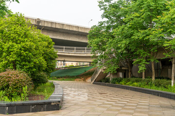 Concrete structure and asphalt road space under the overpass in the city