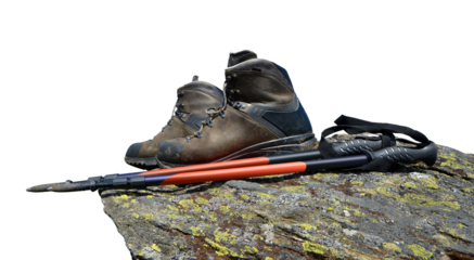 Hiking shoes and Nordic walking poles on the rock isolated, PNG.