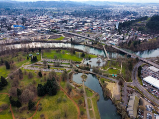 An aerial view of Alton baker park and the Willamette River with a lake 