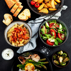 Table of various healthy food dishes. Healthy food assortment. Dieting concept.