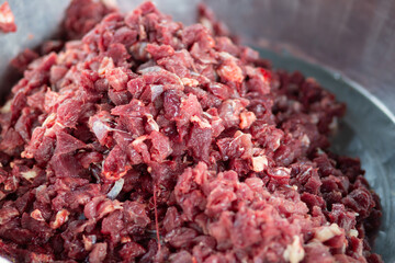 The beef is cut into small pieces ready to be used for cooking.