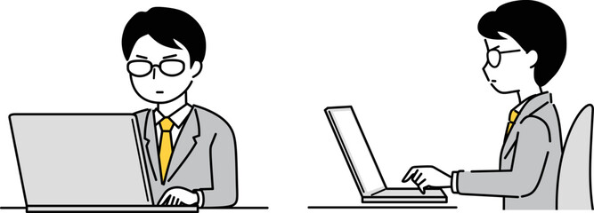 パソコンを操作する眼鏡のビジネスマン