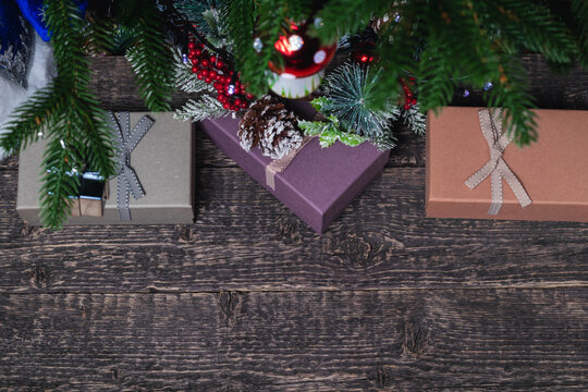 Christmas retro boxes with gifts under a decorated Christmas tree. New Year and Christmas