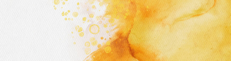 Abstract gold and yellow watercolor paint background.