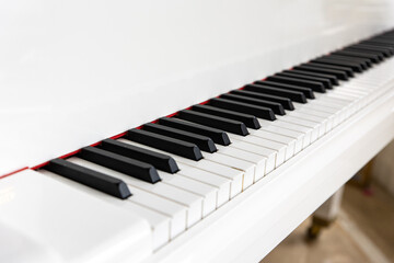 close up of piano keys, white piano