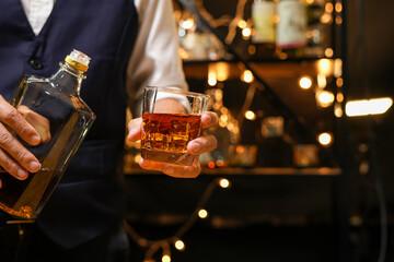 Bartender pouring Whiskey, on  bar,