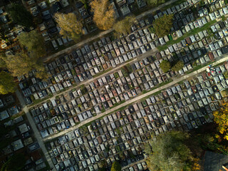Aerial drone view of cemetery and graves on autumn in the morning. Graveyard, view from above. Marble graves in Memorial center. Rows of graves. All Saints Days.